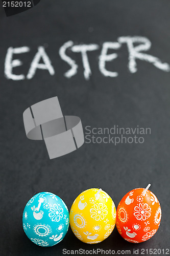 Image of Colorful Easter egg shaped candles and text