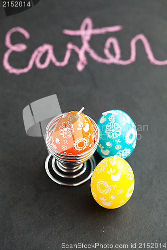 Image of Colorful Easter egg shaped candles and text