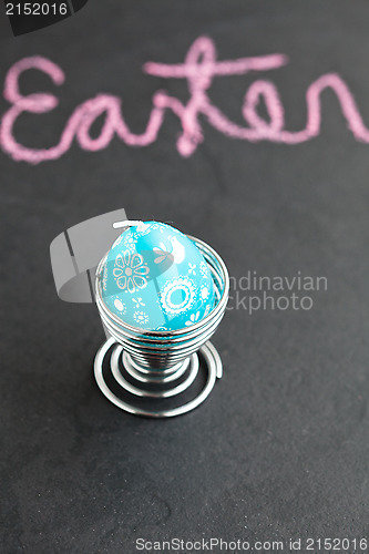 Image of Blue easter egg shaped candle and text