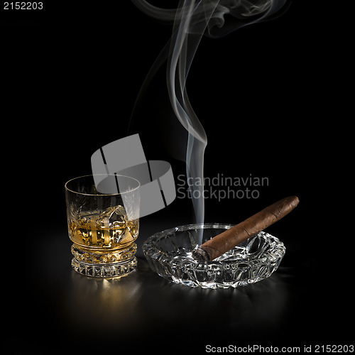 Image of Whiskey and cigar