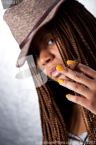 Image of girl with a cigar