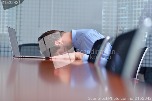 Image of business man with problems and stress in the office