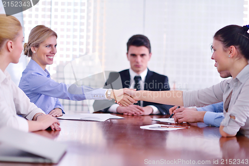 Image of business people making a deal at meeting
