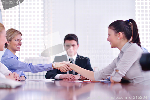 Image of business people making a deal at meeting