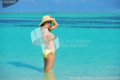 Image of beautiful  woman resting on tropical  beach