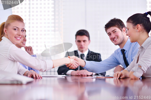 Image of business people making a deal at meeting