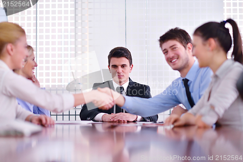 Image of business people making a deal at meeting