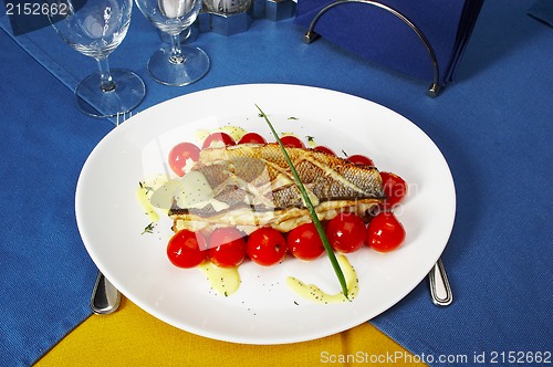 Image of Fish with tomatoes and a potato