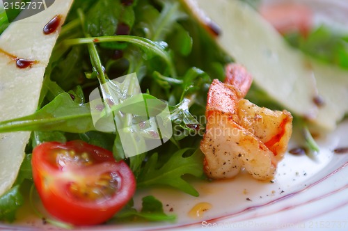 Image of Fresh salad with a tomato, cheese and the fried meat