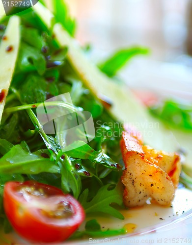 Image of Fresh salad with a tomato, cheese and the fried meat