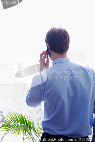 Image of business man talking by cellphone