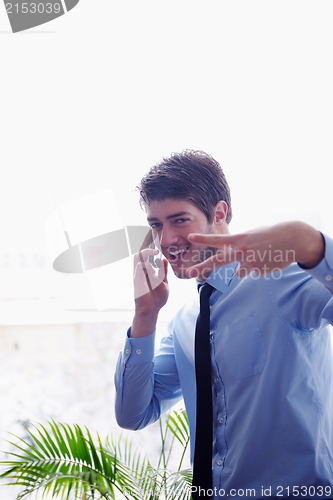 Image of business man talking by cellphone