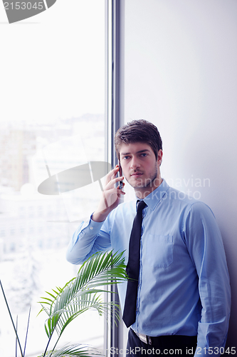 Image of business man talking by cellphone