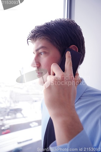 Image of business man talking by cellphone
