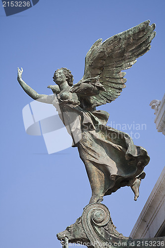 Image of Bronze Angel against blue sky