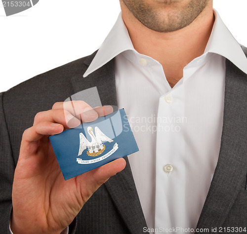 Image of Businessman is holding a business card, Louisiana