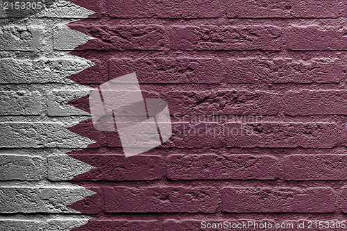 Image of Brick wall with a painting of a flag, Qatar