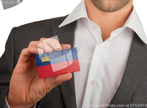 Image of Businessman is holding a business card, Liechtenstein