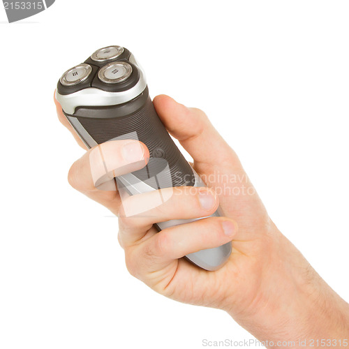 Image of Hand holding an electric shaver 