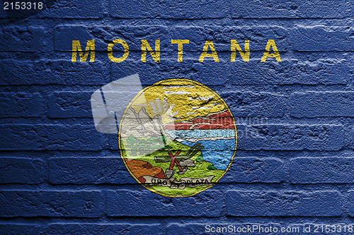 Image of Brick wall with a painting of a flag, Montana
