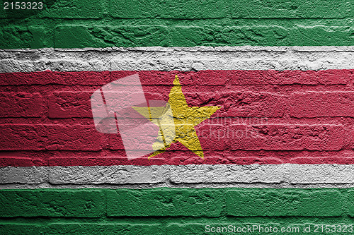Image of Brick wall with a painting of a flag, Suriname