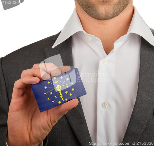 Image of Businessman is holding a business card, Indiana