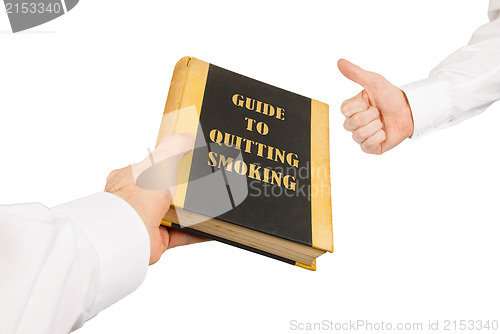 Image of Businessman giving an used book to another businessman