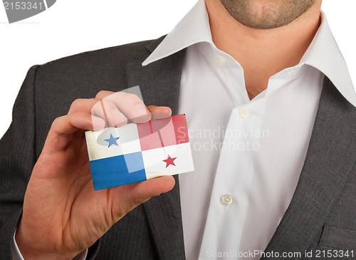 Image of Businessman is holding a business card, Panama