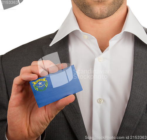 Image of Businessman is holding a business card, Nevada