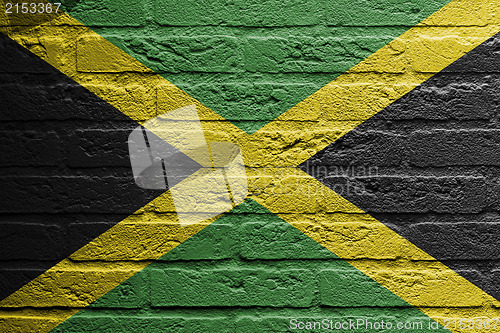 Image of Brick wall with a painting of a flag, Jamaica