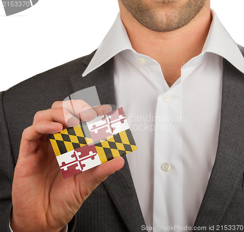 Image of Businessman is holding a business card, Maryland