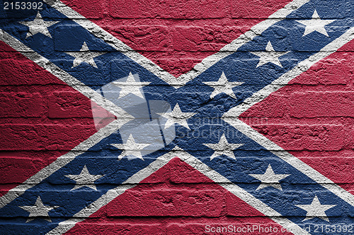 Image of Brick wall with a painting of a flag, confederate flag