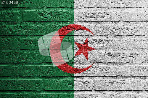 Image of Brick wall with a painting of a flag, Algeria