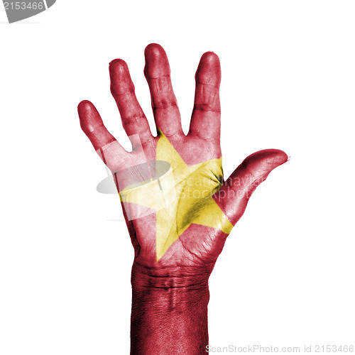 Image of Hand of an old woman, wrapped with a pattern of the flag of Viet