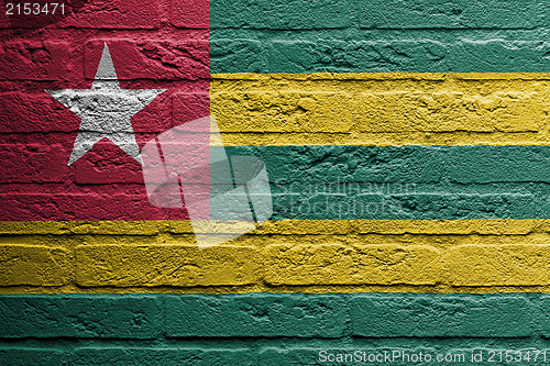 Image of Brick wall with a painting of a flag, Togo