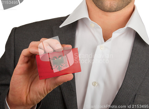 Image of Businessman is holding a business card, Albania