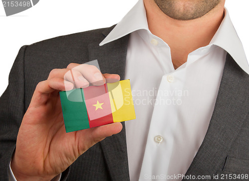 Image of Businessman is holding a business card, Cameroon