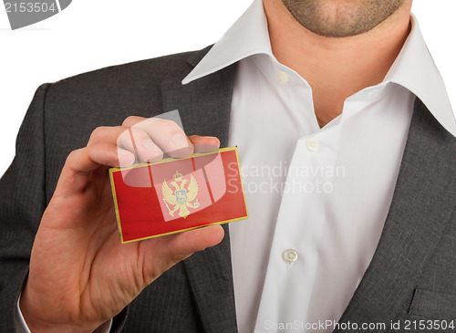 Image of Businessman is holding a business card, Montenegro