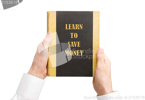 Image of Businessman holding an old book