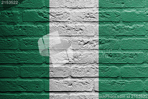 Image of Brick wall with a painting of a flag, Nigeria