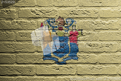 Image of Brick wall with a painting of a flag, New Jersey