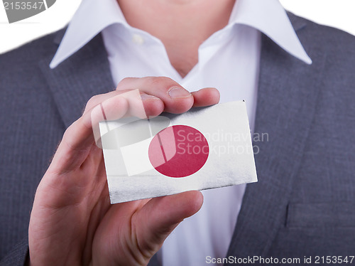 Image of Businessman showing card, matte paper effect