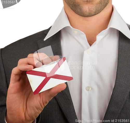 Image of Businessman is holding a business card, Alabama
