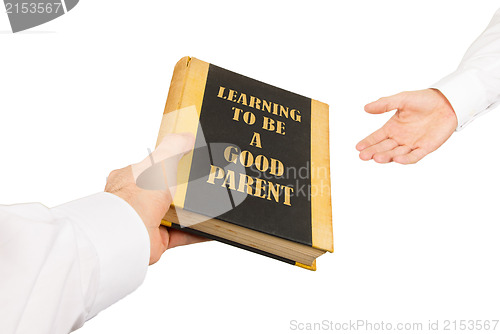 Image of Businessman giving an used book to another businessman