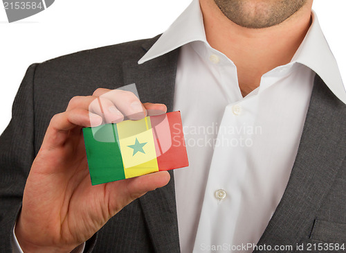 Image of Businessman is holding a business card, Senegal