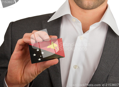 Image of Businessman is holding a business card, Papua New Guinea