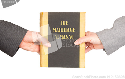 Image of Man and woman holding a marriage almanac