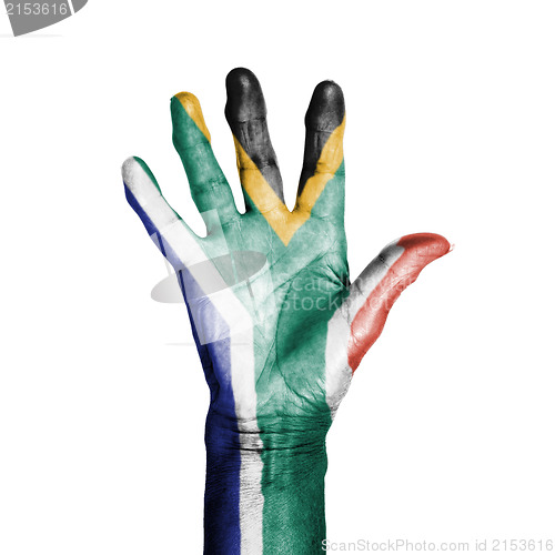 Image of Hand of an old woman, wrapped with a pattern of the flag of Sout