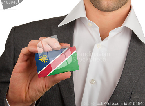 Image of Businessman is holding a business card, Namibia