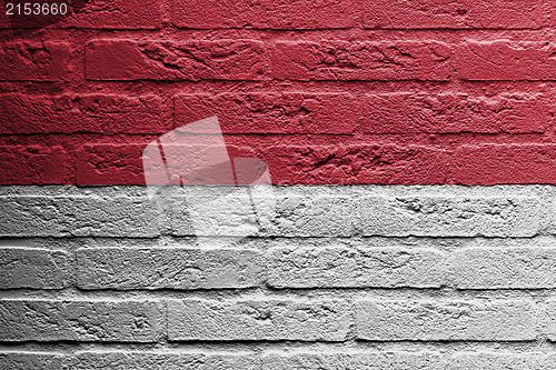 Image of Brick wall with a painting of a flag, Indonesia